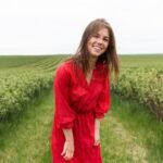 woman-with-red-dress-field_23-2148574772